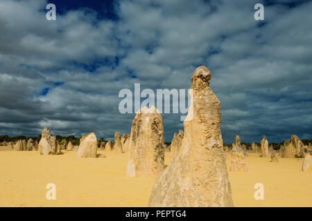 Dark Clouds and bizzar stone formations in Pinnacles desert, Nambung National Park, Western Australia, Oceania Stock Photo