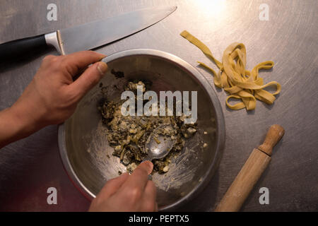 Male baker preparing food in bakery Stock Photo