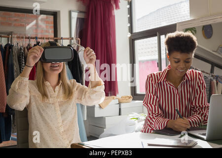 Fashion designers using virtual reality headset and graphic tablet Stock Photo