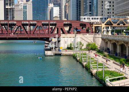 Chicago River,the Riverwalk, Kayaks, The Elevated Train  and surrounding downtown architecture in summer, Chicago, Illinois, USA
