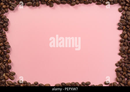 Lots of coffee beans around pastel background website textspace Stock Photo