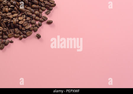 Lots of coffee beans on pastel background website textspace Stock Photo
