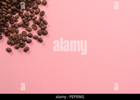 Lots of coffee beans on pastel background website textspace Stock Photo