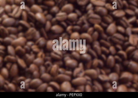 Lots of blurred coffee beans website background textspace Stock Photo