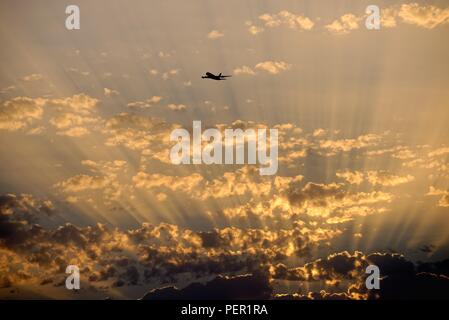 Sunset showing dramatic crepuscular rays caused by high altitude dust in the atmosphere Stock Photo