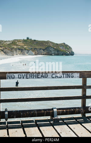 Sign on the pier that reads no overhead casting Stock Photo