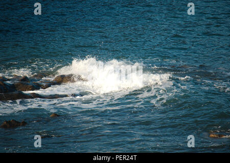 Waves breaking on rocks on the North Devon (UK) coastline. Stock Photo