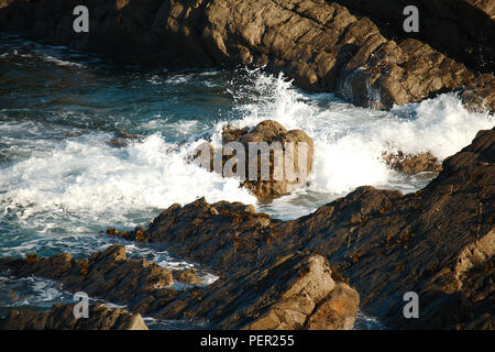 Waves breaking on rocks on the North Devon (UK) coastline. Stock Photo