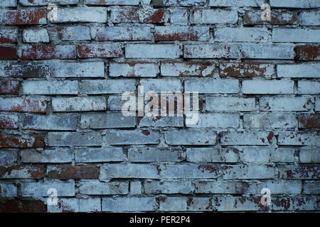 Background image: a fragment of an old brick wall. Stock Photo
