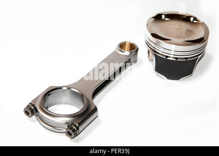 A picture of the light forged sport and racing piston and connecting rod. Isolated on white background. Stock Photo