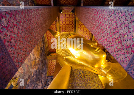 big golden buddha head in Wat Pho buddhist temple in Bangkok , Thailand