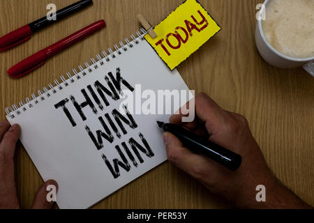 Handwriting text writing Think Win Win. Concept meaning Business Strategy Competition Challenge Way to be success Man holding marker notebook clothesp Stock Photo