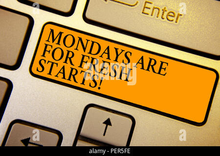 Text sign showing Mondays Are For Fresh Starts. Conceptual photo Begin again every week have a good morning Keyboard orange key Intention create compu Stock Photo