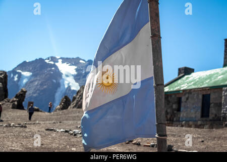 Argentina flag with Cerro Tolosa Mountain on background in Cordillera de Los Andes - Mendoza Province, Argentina Stock Photo
