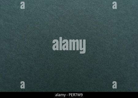 Dark green color cardboard texture desktop background Stock Photo