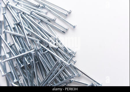 Steel nails on a white background Stock Photo