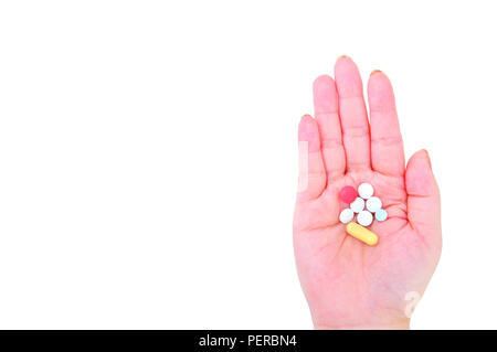 Hand Holding Pills isolated on white background Stock Photo