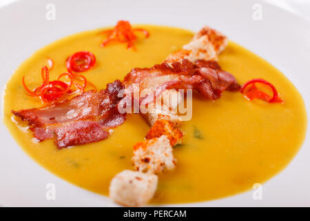 Traditional Spanish cold soup, with bread sticks and bacon chips. Corn Spanishwith bacon. chowder Stock Photo