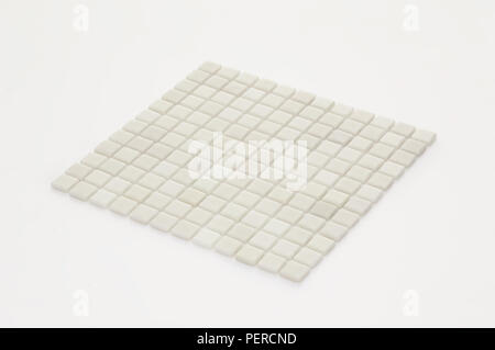 little white ceramic tile on a light background, majolica. for the catalog Stock Photo