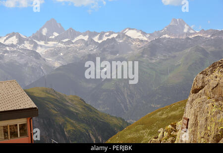 The Finsteraarhorn(left) and Lauteraarhorn (right) in the Bernese Alps viewed from the Nufenen Pass in Southern Switzerland Stock Photo
