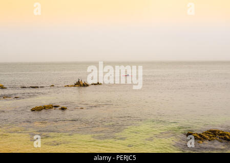 Oceans and rocks in dramatic day Stock Photo