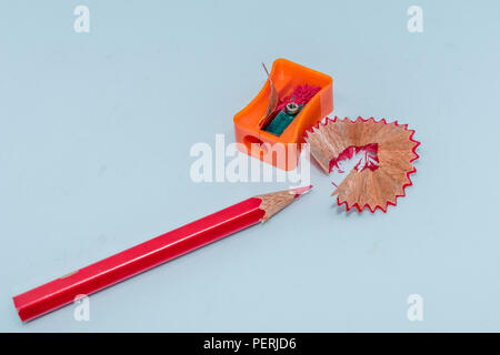 Selective Focus: Color pencil with sharpener shavings on white background Stock Photo