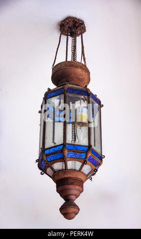 Intricate old street lamp with ornate blue glass and copper detailing in Chinatown in Singapore Stock Photo