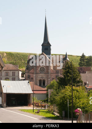 View of the French village of Etoges, France, and it's small church surrounded by vineyards Stock Photo