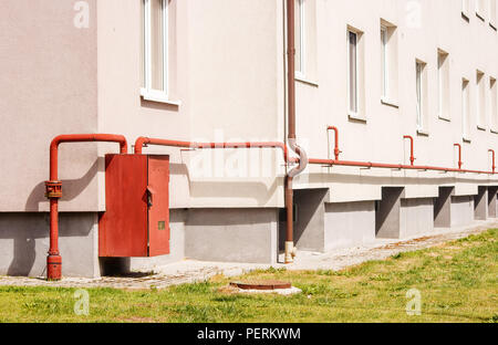 modern gas distributor on the wall of the house on sunny summer day Stock Photo