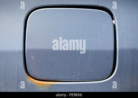 Rusty and dirty gasoline filler cap of old car in retro design. Stock Photo