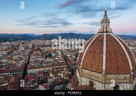 Florence, Italy - March 23, 2018: Tourists gather on the cupola of Florence's Duomo cathedral to watch the sunset. Stock Photo