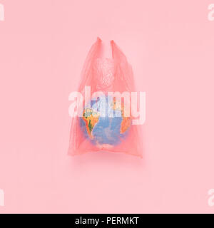 The globe in a plastic bag, the concept of global pollution Stock Photo