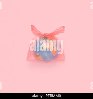 The globe in a plastic bag, the concept of global pollution Stock Photo
