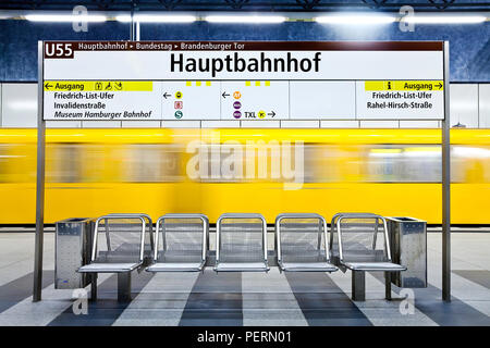 Europe, Germany, Berlin, modern subway station  - moving train pulling into the station Stock Photo