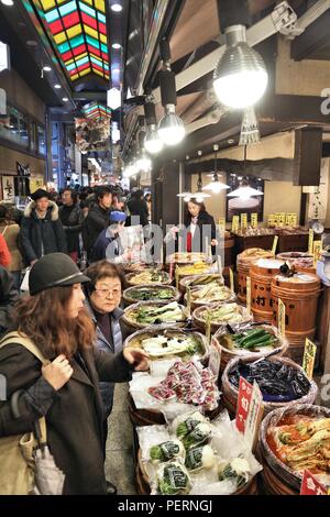 KYOTO, JAPAN - NOVEMBER 27, 2016: People shop at Nishiki Market in Kyoto, Japan. Nishiki is a popular traditional food market in Kyoto. Stock Photo