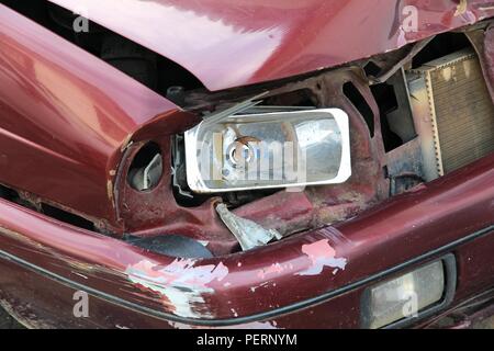 Small generic car with dented front wing. Vehicle accident result. Stock Photo