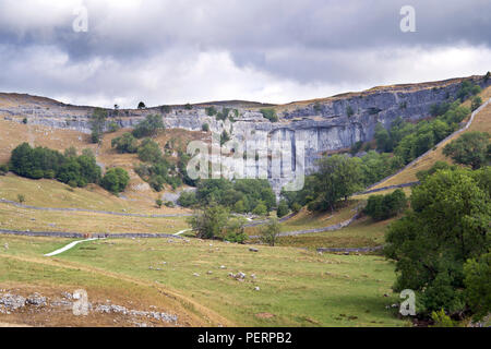 Malham Cove in the Yorkshire Dales was created at the end of the last Ice Age by a waterfall carrying meltwater from glaciers. Stock Photo