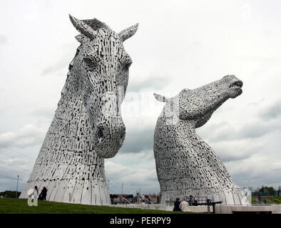 The two giant Kelpie horse sculptures that sit in on the Forth and Clyde canal at the Helix park complex at Falkirk, Scotland. The Kelpies are a tribute to the heavy horses that used to work on the canals in Scotland, pulling barges loaded with cargo. They were designed and built by the artist; Andy Scott. Stock Photo