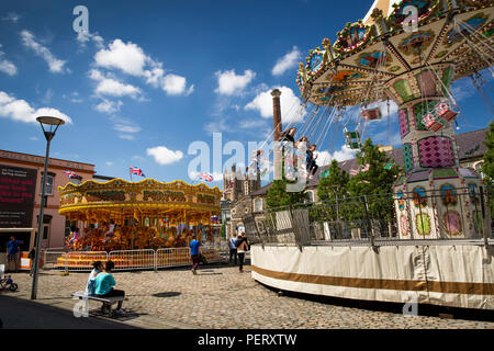England, Bristol, Millennium Square, children enjoying  traditonal funfair rides Stock Photo
