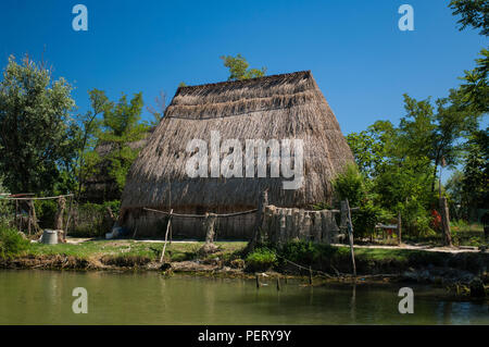 A casone, a typical reed-built house, once used by fishermen in the area near Caorle, Veneto, Italy