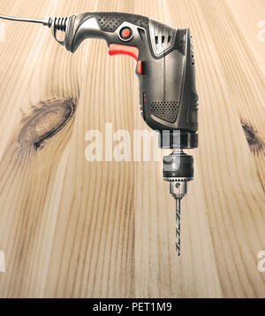 electric drill on the wood Stock Photo