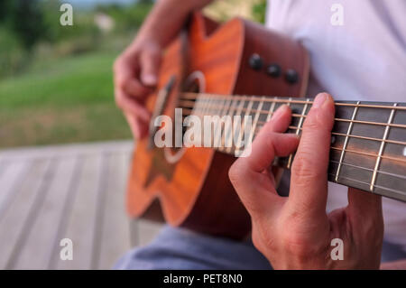 Close-up of a man playing guitar Stock Photo