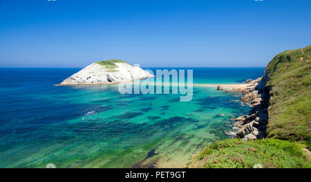 Cantabria, coastal landscape along Costa Quebrada, The Broken Coast, spectacular beach Playa de Los Covachos, sandbanks partially exposed by low tide Stock Photo