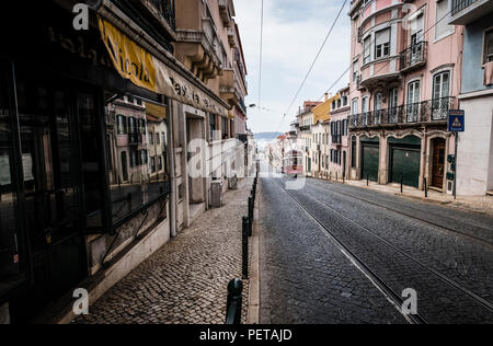 Famous retro yellow tram on the street in Lisbon city, Portugal Stock Photo