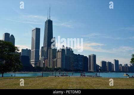 The skyline of Chicago's Streeterville neighborhood as seen from Milton Olive Park rises above Lake Michigan. Stock Photo