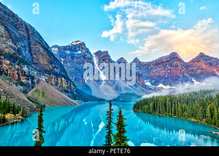 Sunrise over the Valley of the Ten Peaks with glacier-fed Moraine Lake in the foreground in the Canadian Rockies. Stock Photo