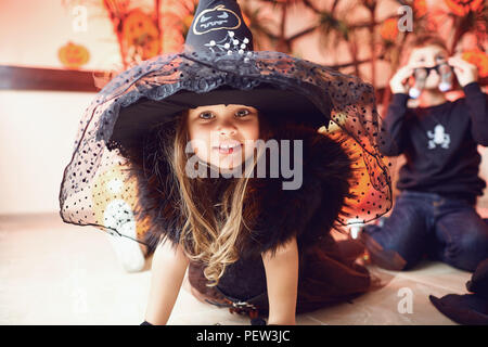 Funny little girl in a Halloween costume Stock Photo