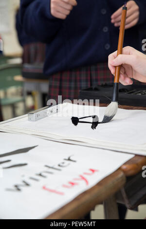 Japanese high school student practices calligraphy Stock Photo - Alamy