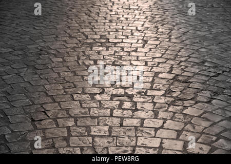 old cobblestone street warm light background texture Stock Photo