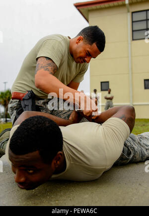 Airmen practice with less-than-lethal weapons during an augmentee ...